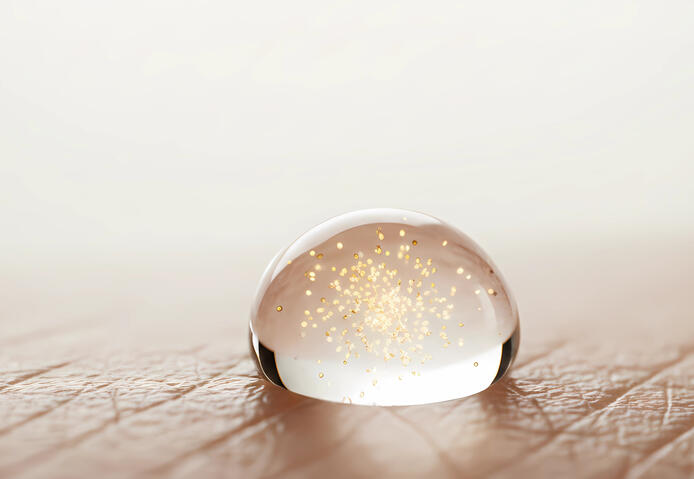 Macro photography of water droplets and bubbles representing cellular health.